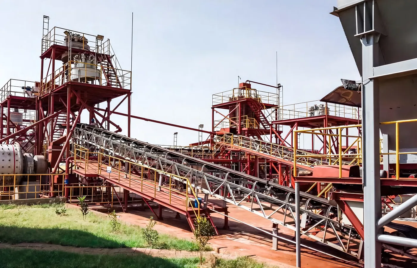 Conveyor and screening structure at a plant